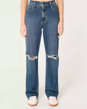 Bardzo wysokie, podarte, ciemnoniebieskie jeansy typu dad jeans