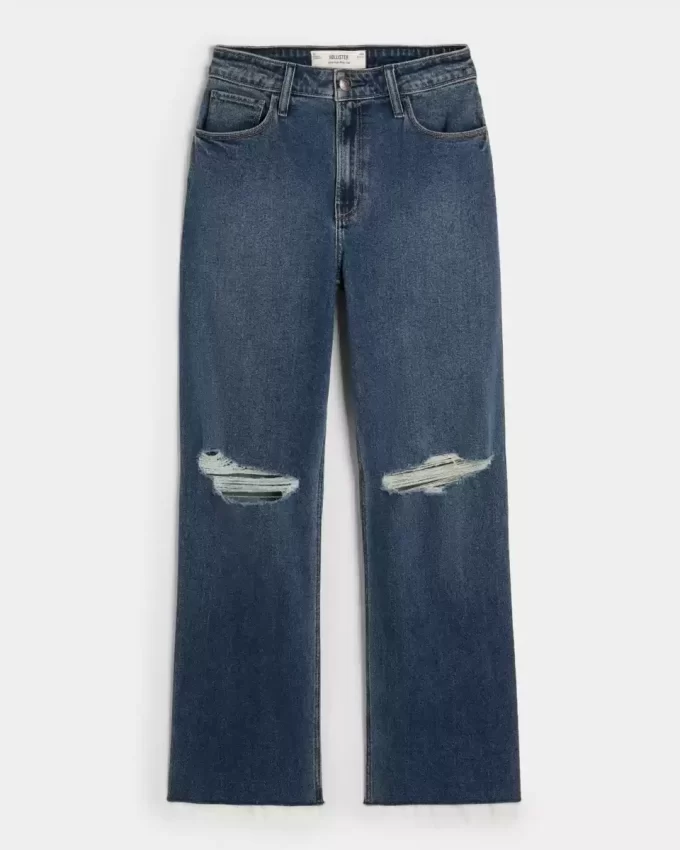Bardzo wysokie, podarte, ciemnoniebieskie jeansy typu dad jeans