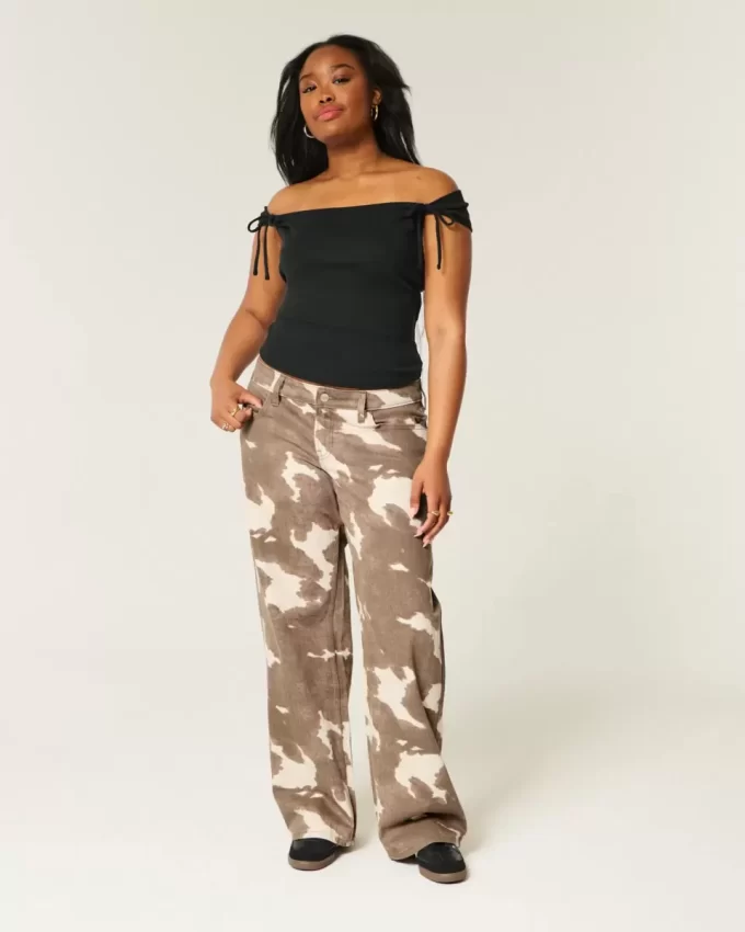 Dżinsy Baggy z niskim stanem i nadrukiem krowim Dżinsy Baggy z niskim stanem i nadrukiem krowim