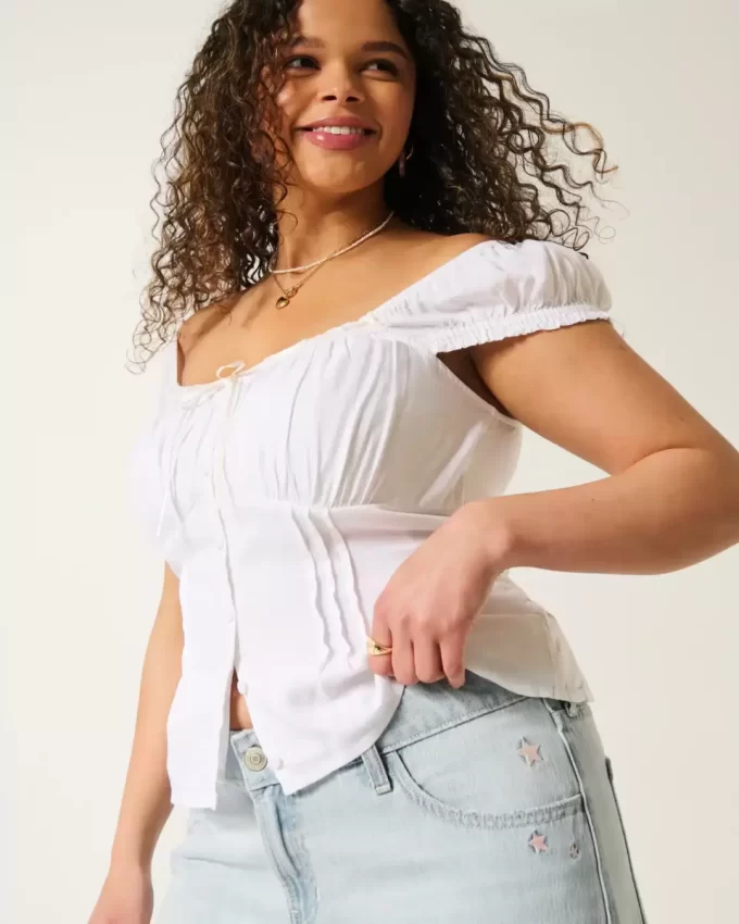 Jeansy Baggy z niskim stanem i lekkim spraniem, haftowane w gwiazdy Jeansy Baggy z niskim stanem i lekkim spraniem, haftowane w gwiazdy