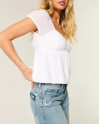 Jeansy Baggy z niskim stanem i średnim spraniem w motyle