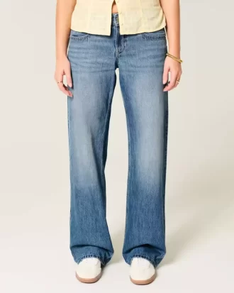 Jeansy Baggy z niskim stanem i średnim spraniem, zdobione ćwiekami w serca Jeansy Baggy z niskim stanem i średnim spraniem, zdobione ćwiekami w serca