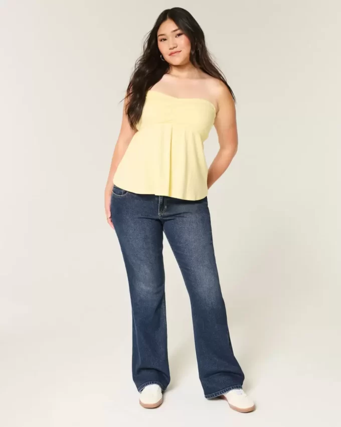 Jeansy Bootcut z niskim stanem i ciemnym spraniem