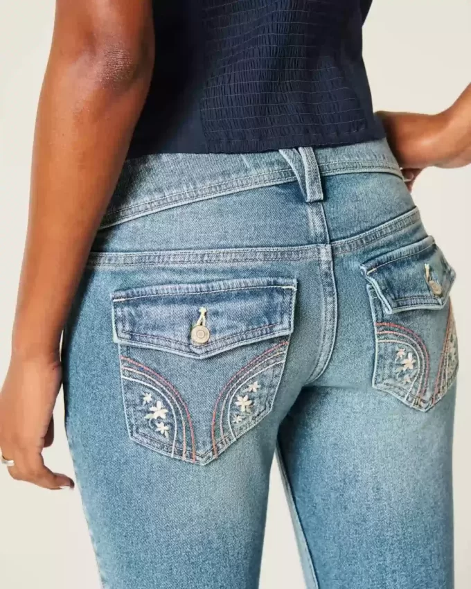 Jeansy Bootcut z niskim stanem i średnim spraniem, haftowane kwiaty