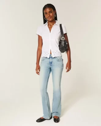 Jeansy Bootcut z niskim stanem i średnim spraniem, haftowane motyle Jeansy Bootcut z niskim stanem i średnim spraniem, haftowane motyle