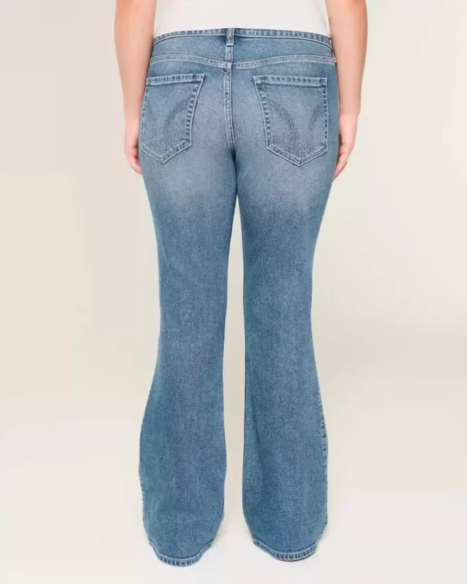 Jeansy Bootcut z niskim stanem i rozdarciami w średnim odcieniu