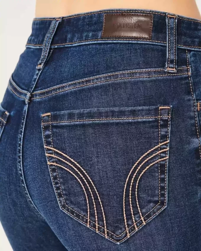 Jeansy dzwony z wysokim stanem i rozdarciami w ciemnym odcieniu