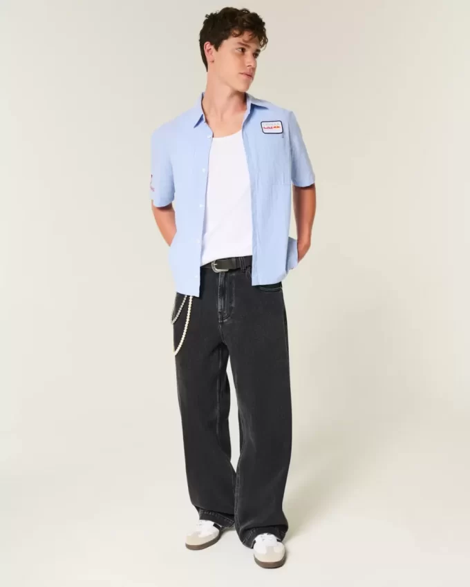 Jeansy Super Baggy z grafiką „Sprane czarne gwiazdy” Jeansy Super Baggy z grafiką „Sprane czarne gwiazdy”