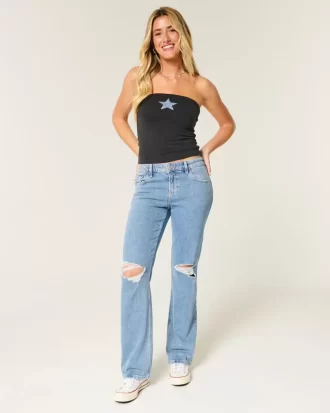 Jeansy z niskim stanem i rozdarciami, o średnim stopniu sprania, luźne, proste