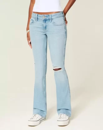 Jeansy z niskim stanem, rozdarciami i lekkim spraniem, z haftowanym krojem Bootcut