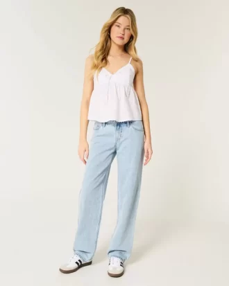 Luźne jeansy z niskim stanem i lekkim spraniem
