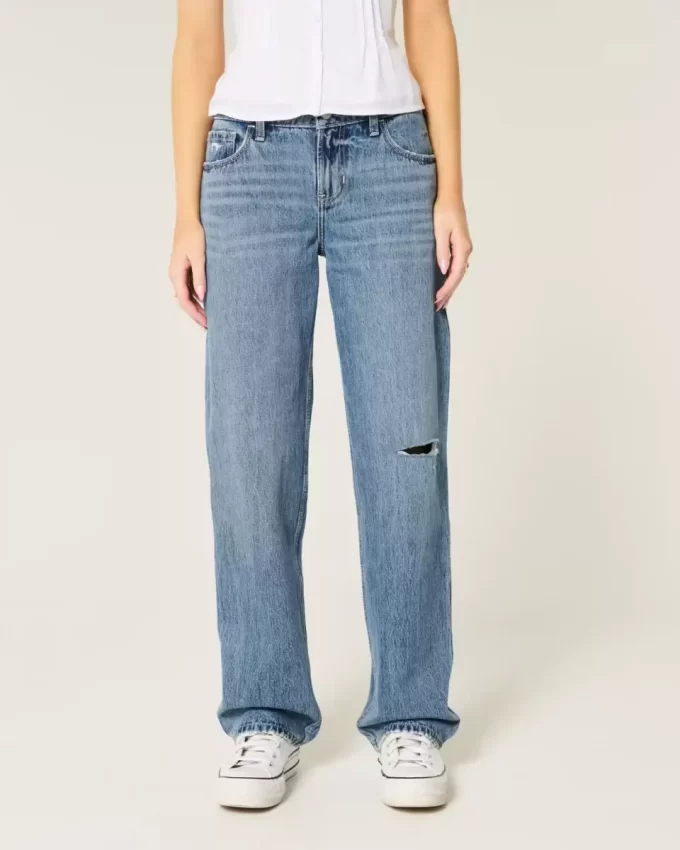 Luźne jeansy z niskim stanem i rozdarciami, o średnim stopniu sprania Luźne jeansy z niskim stanem i rozdarciami, o średnim stopniu sprania