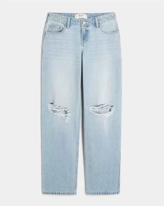 Luźne, lekko sprane jeansy z niskim stanem i podartymi nogawkami Luźne, lekko sprane jeansy z niskim stanem i podartymi nogawkami