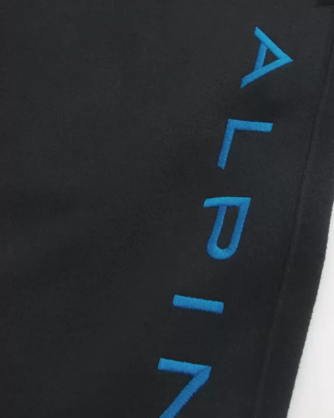 Luźne spodnie dresowe z polaru z grafiką alpejską